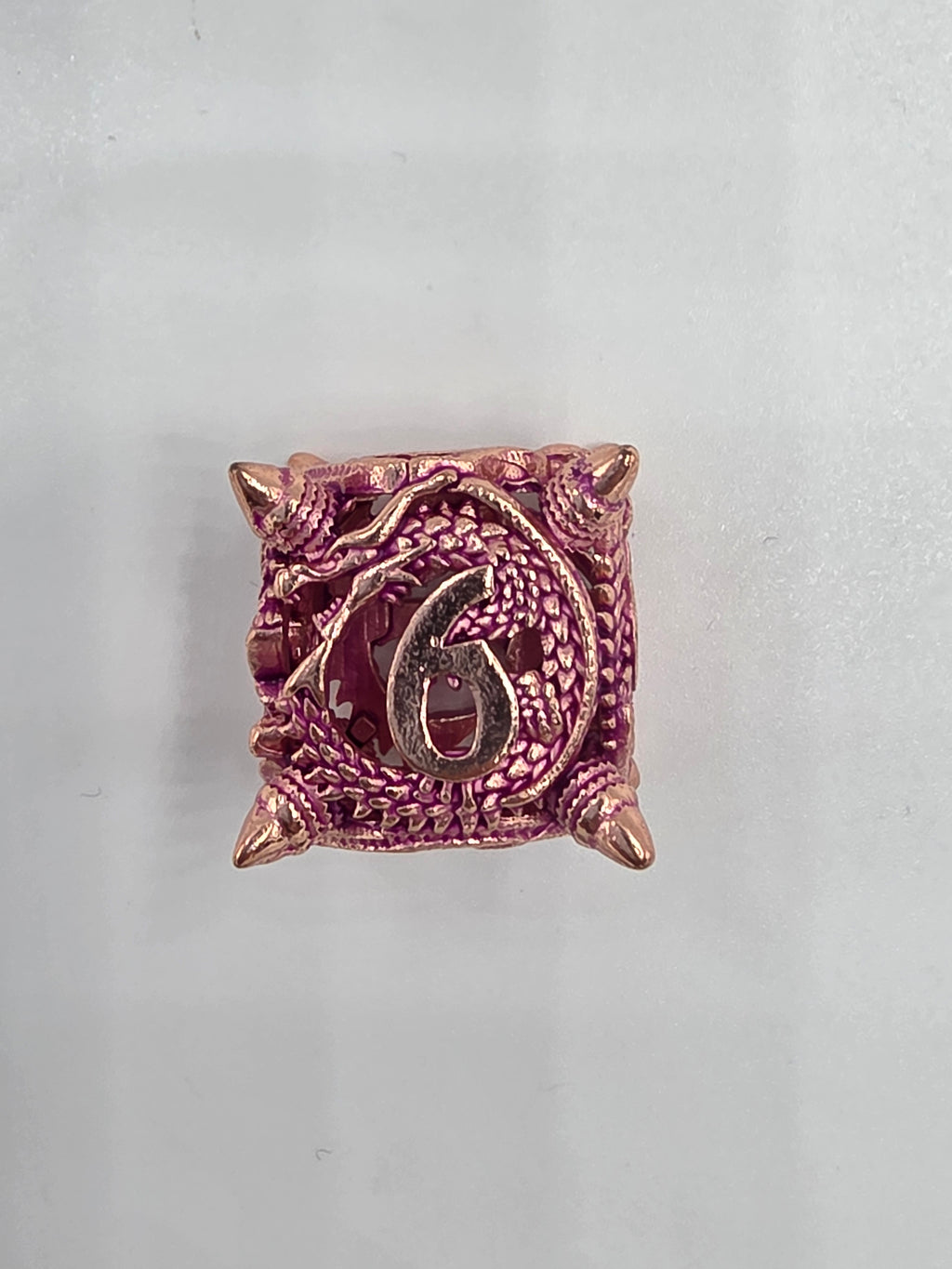 Hollow pink metal dragon dice set