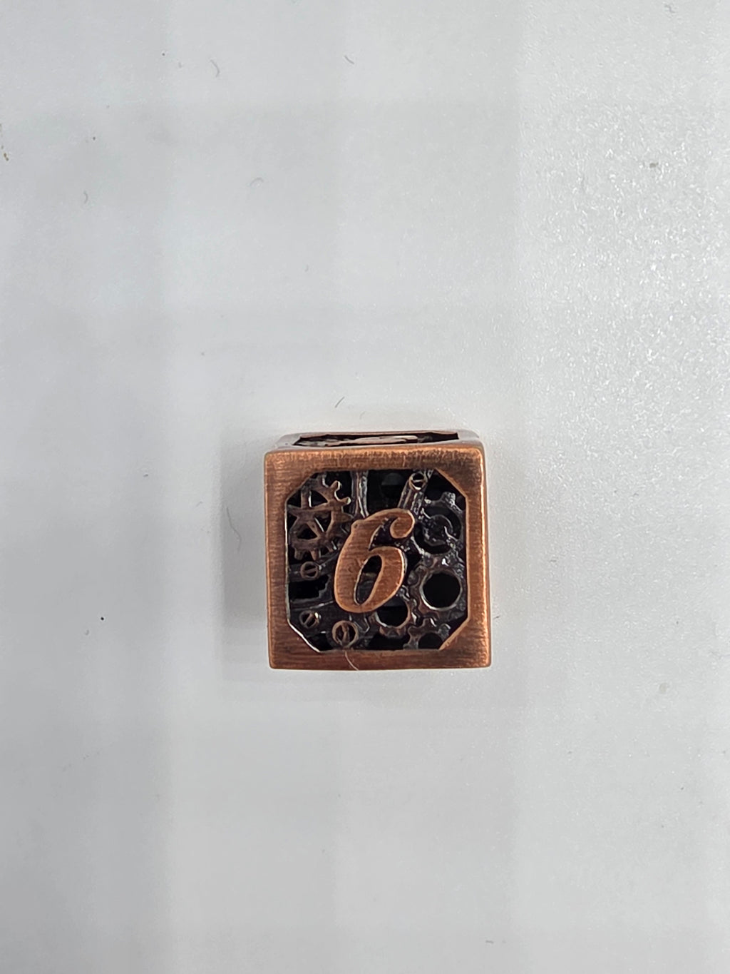 Hollow metal gear dice set
