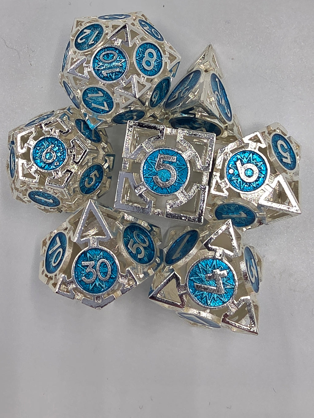 Hollow silver and blue dice set