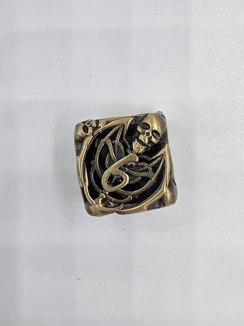 Hollow bronze skeleton dice set