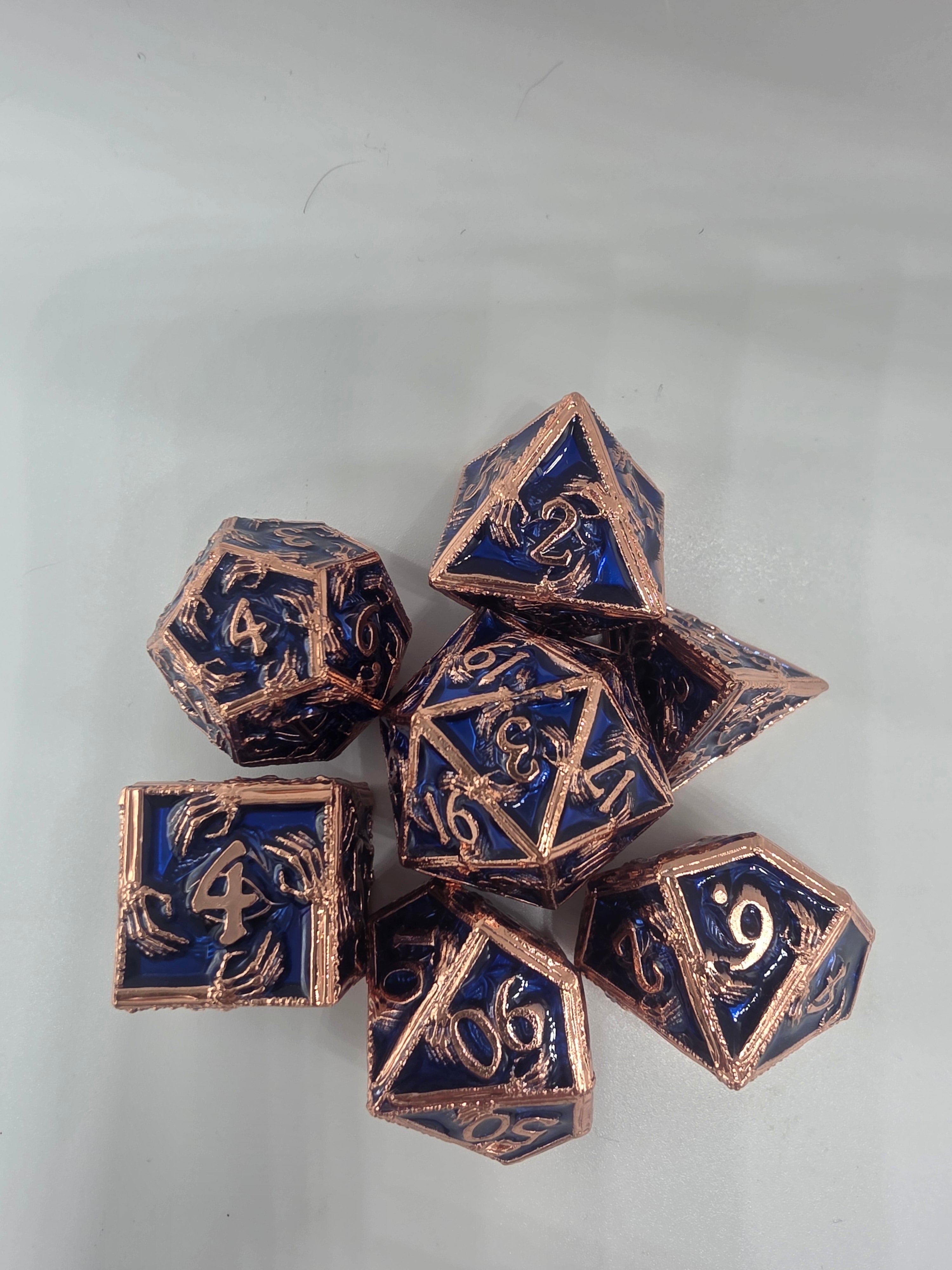Hands on solid metal dice set