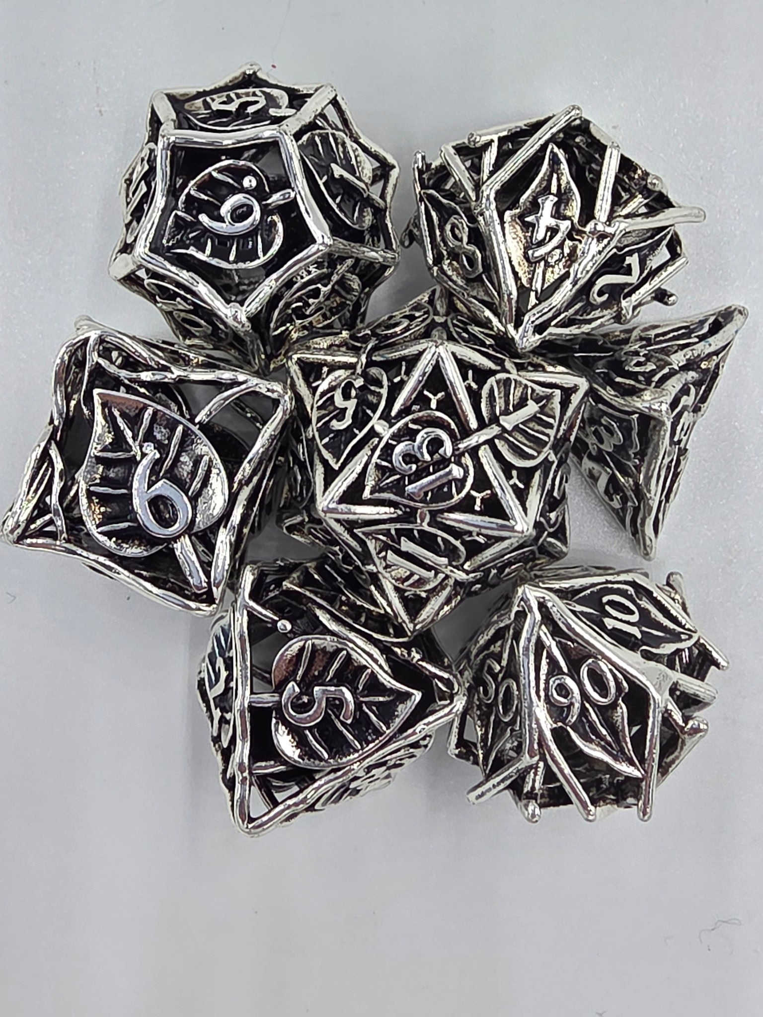 Hollow silver leaf dice set
