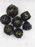 Black and gold hollow dice set