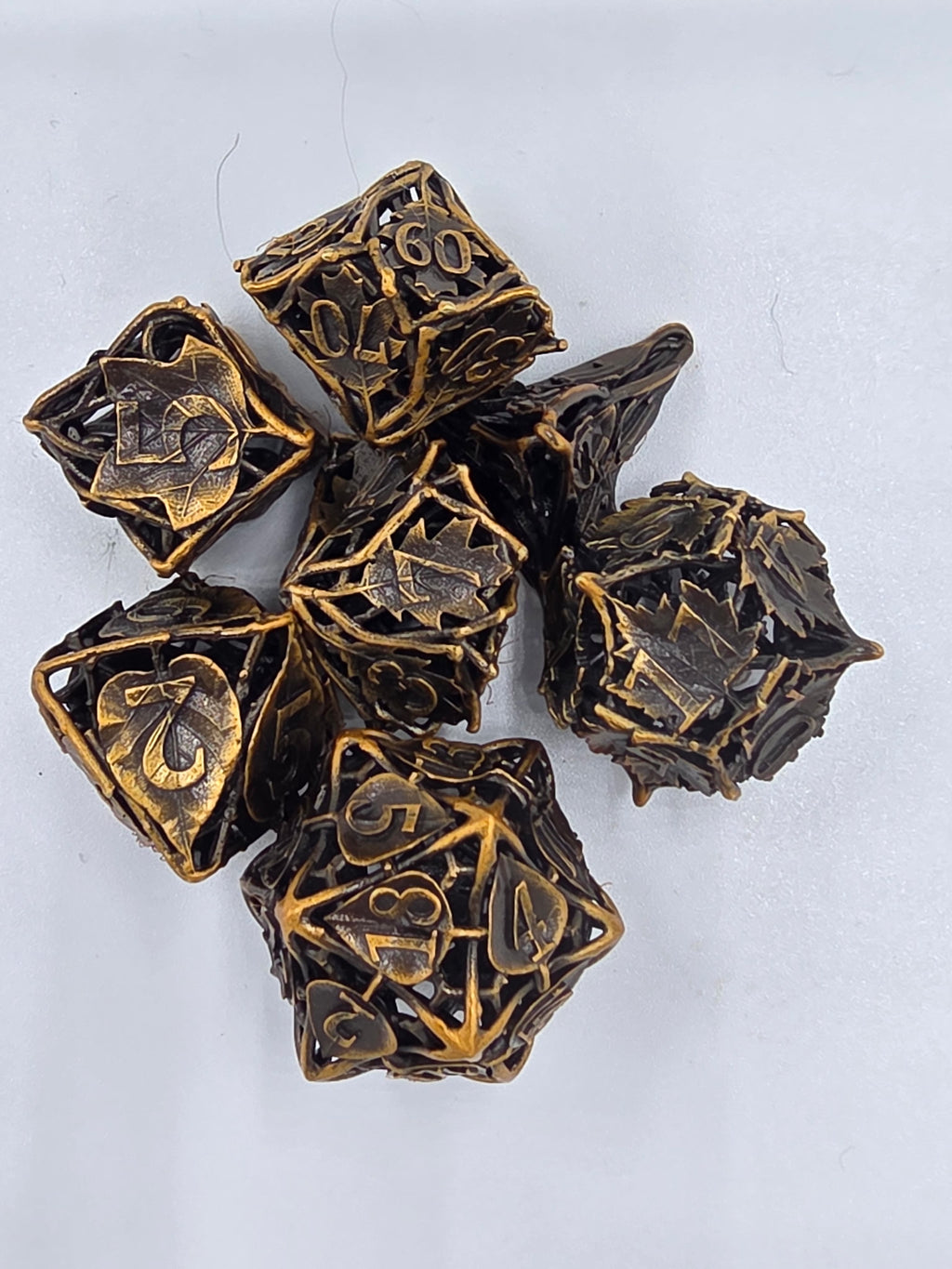 Hollow bronze leaf dice set