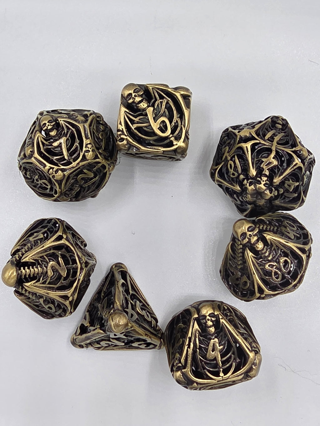 Hollow bronze skeleton dice set