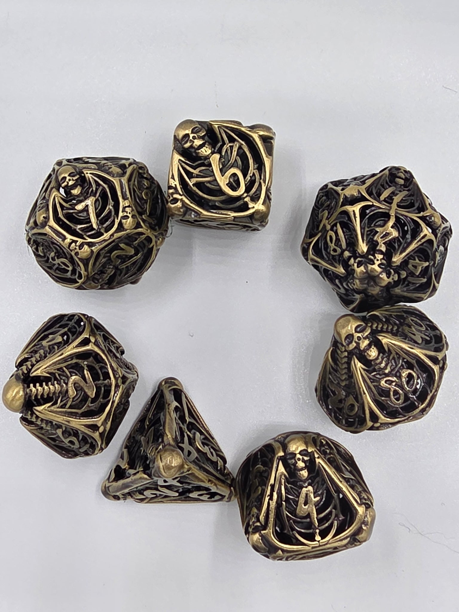 Hollow bronze skeleton dice set