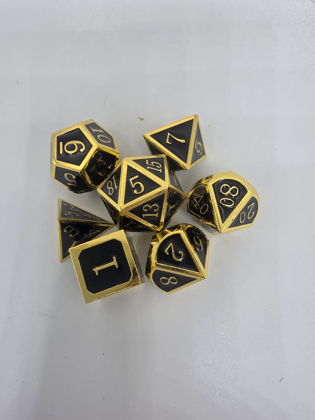 Solid metal black on gold dice set