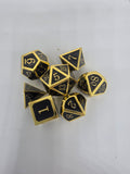 Solid metal black on gold dice set