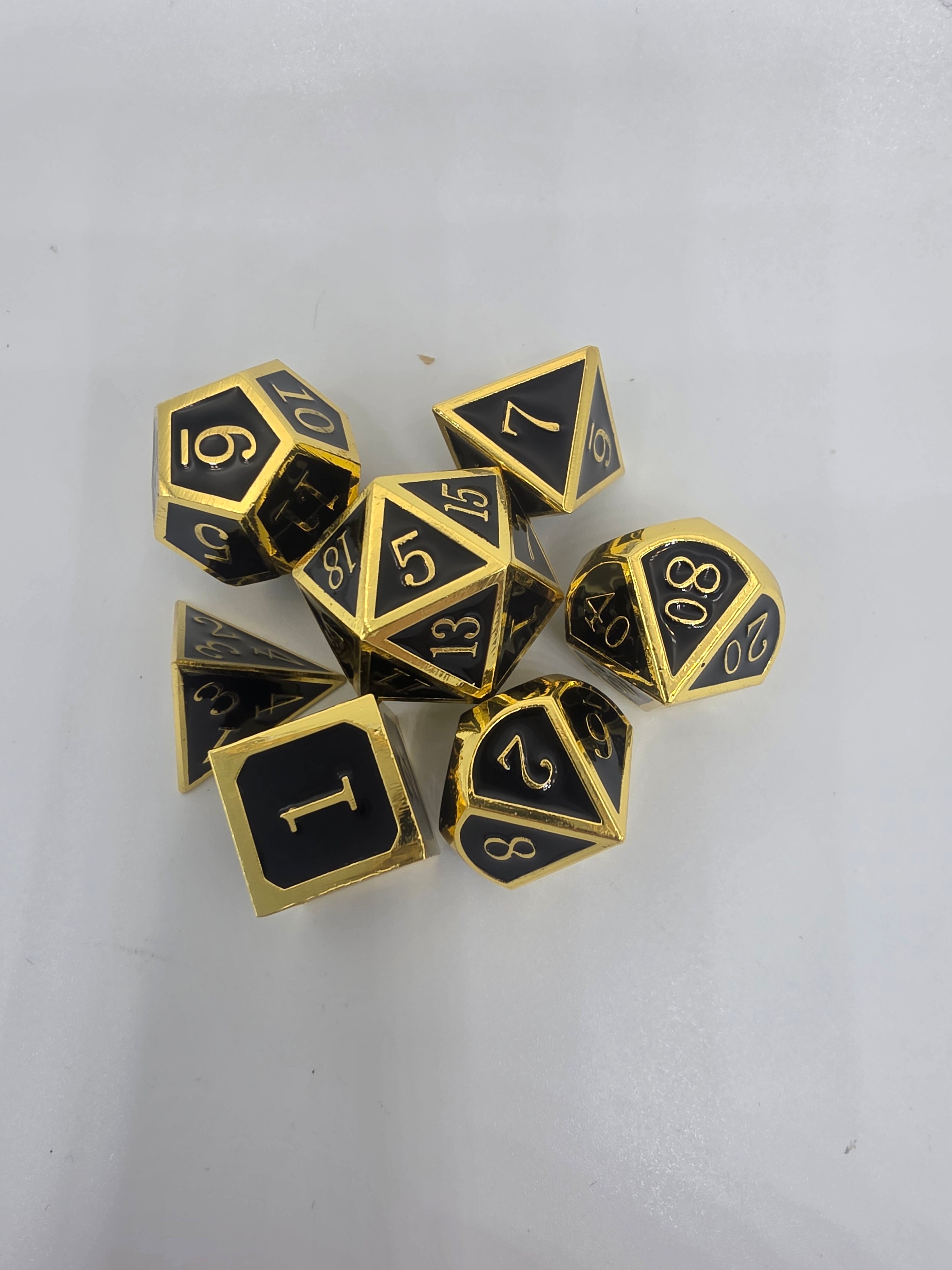 Solid metal black on gold dice set