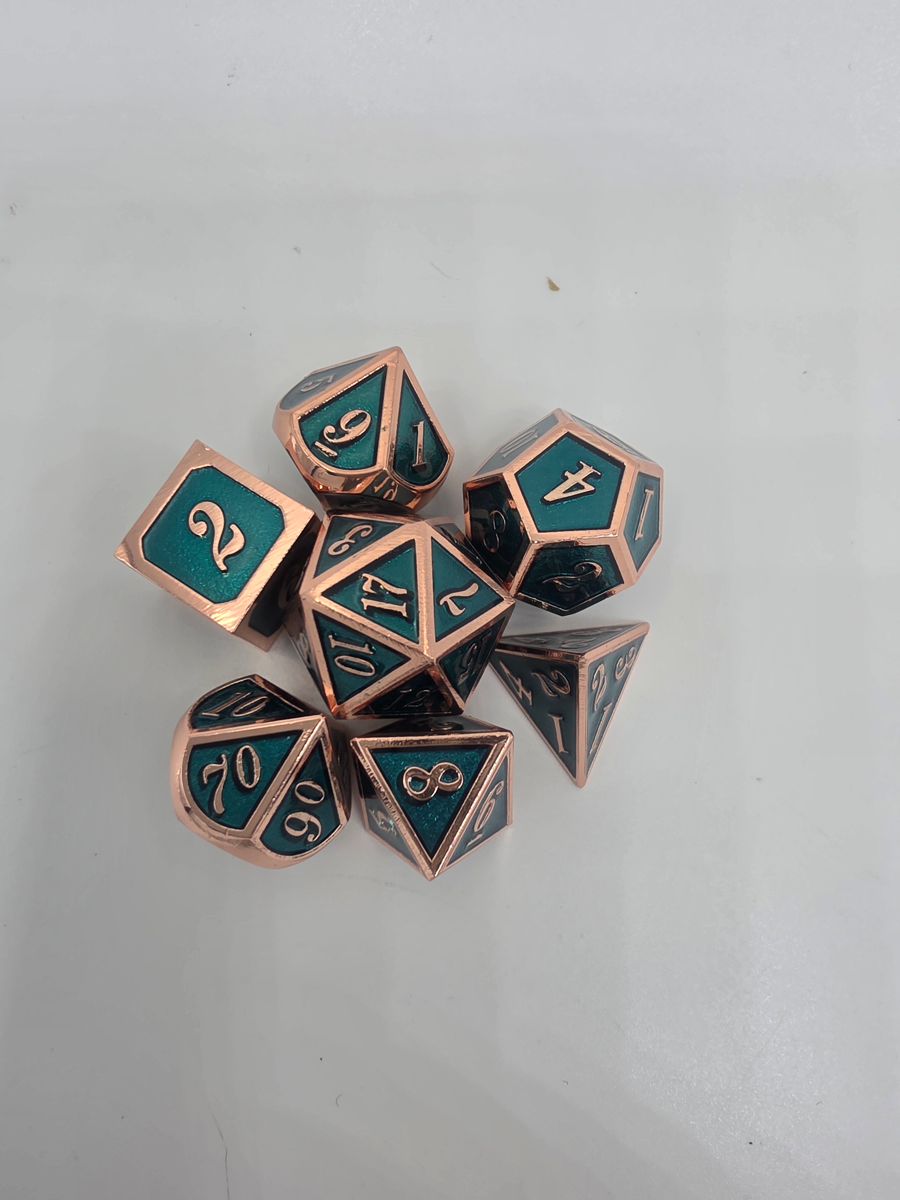 Solid metal teal dice set