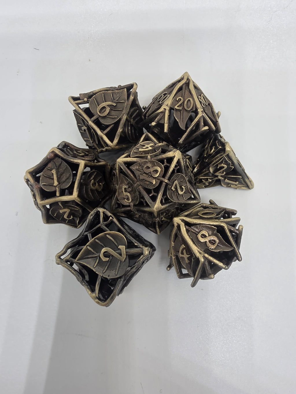 Hollow metal leaf dice set