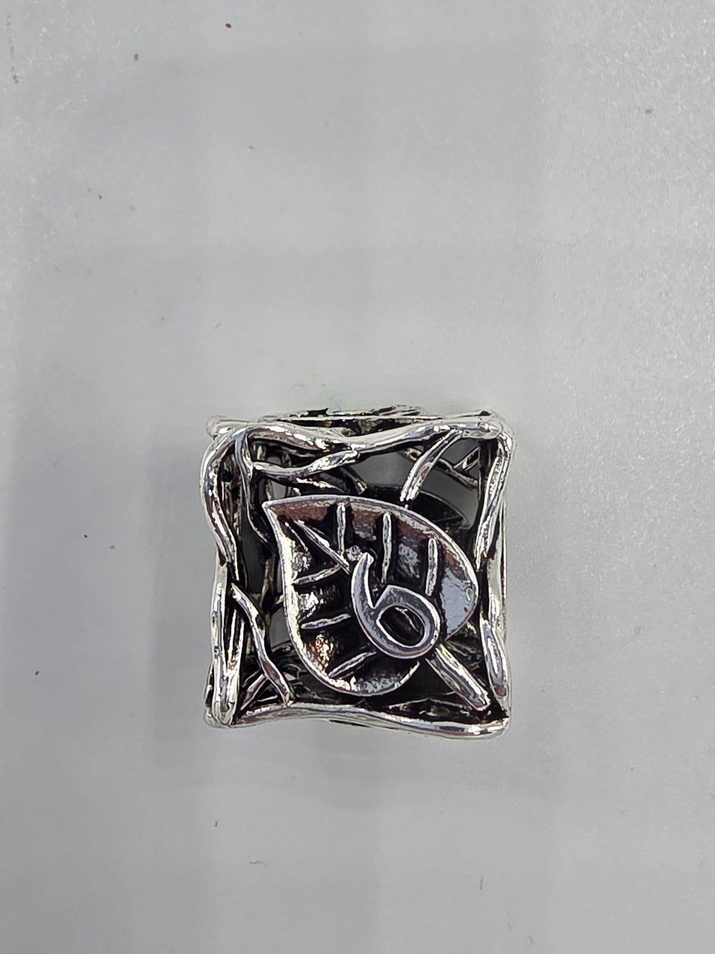 Hollow silver leaf dice set