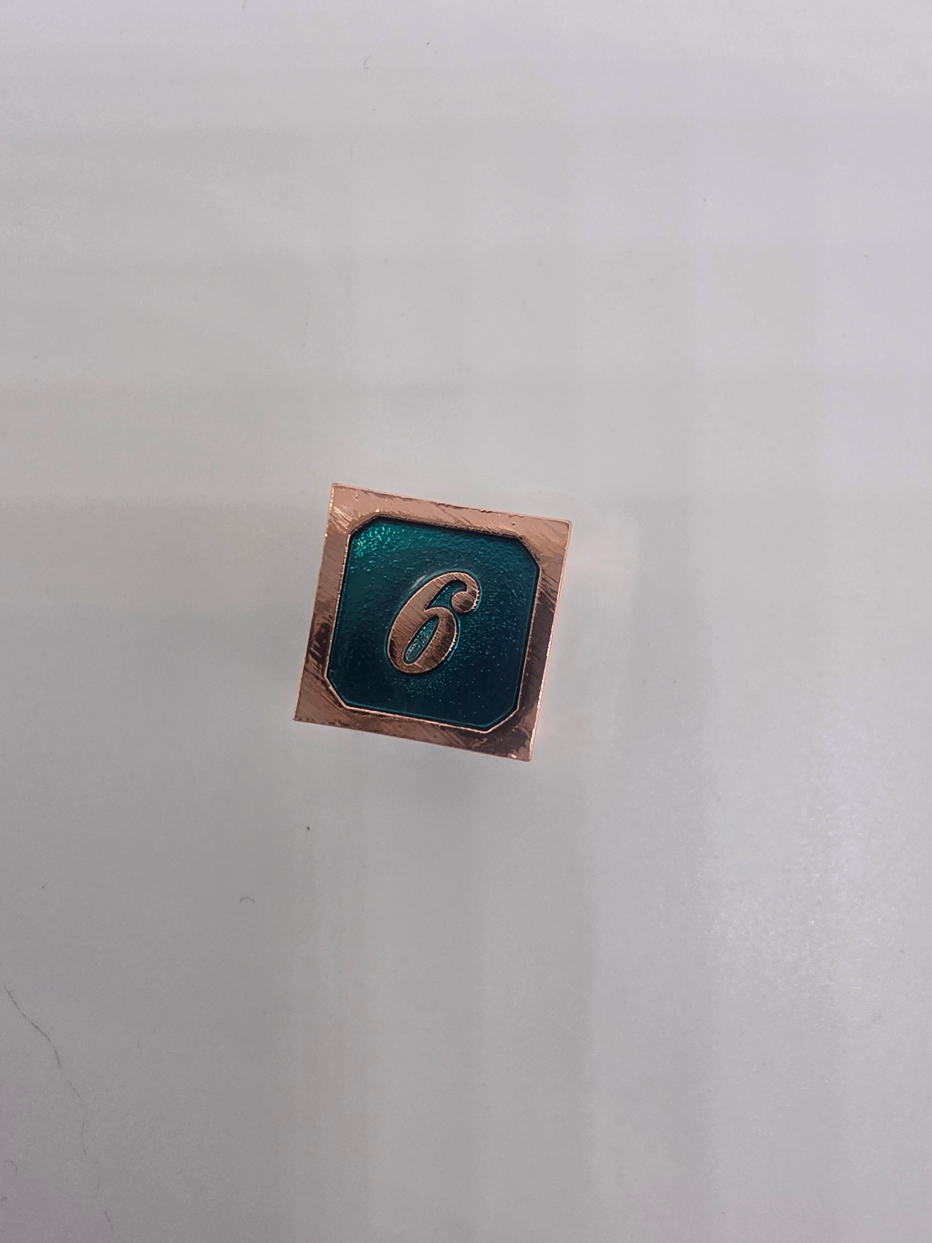 Solid metal teal dice set