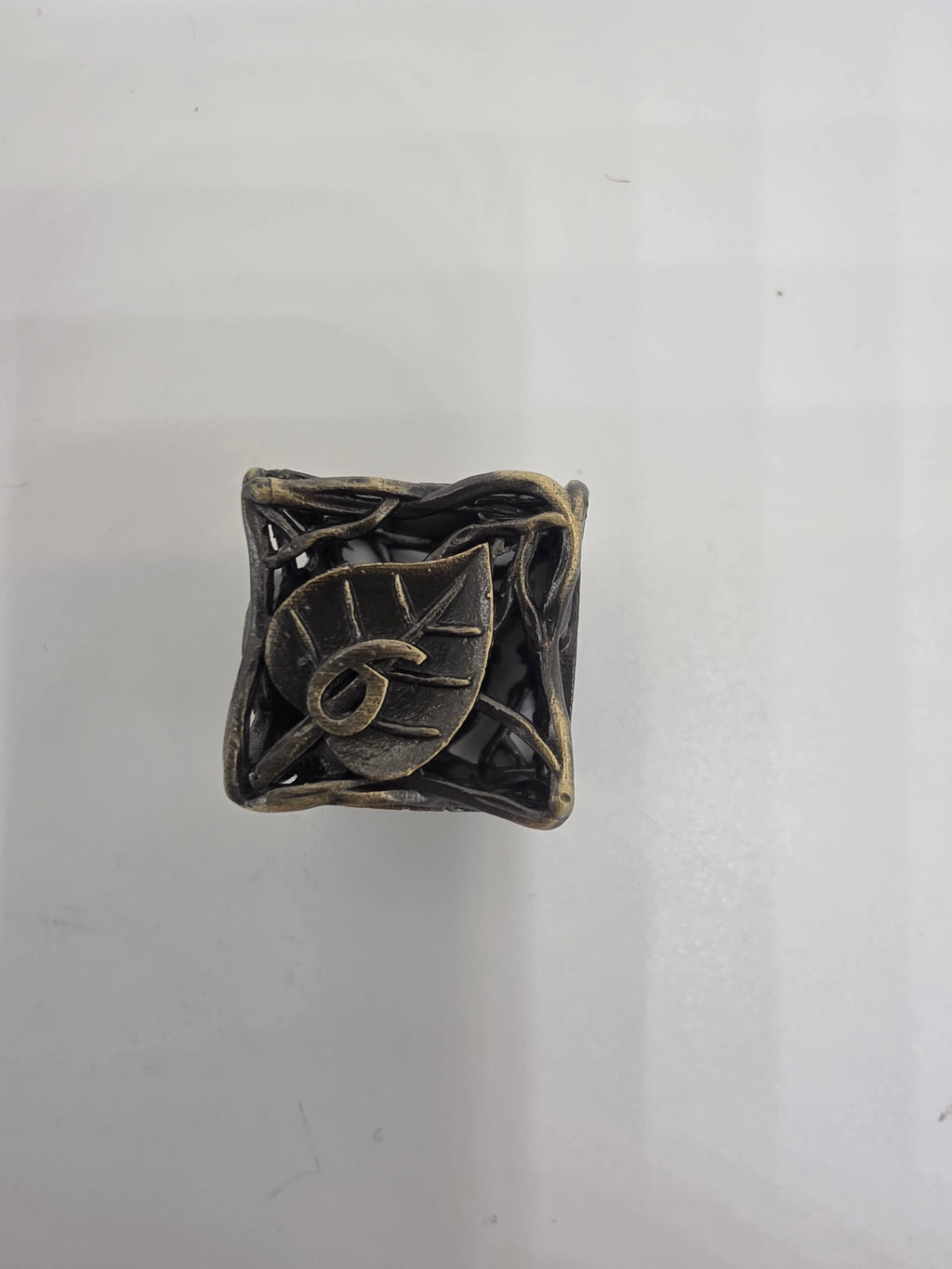 Hollow metal leaf dice set