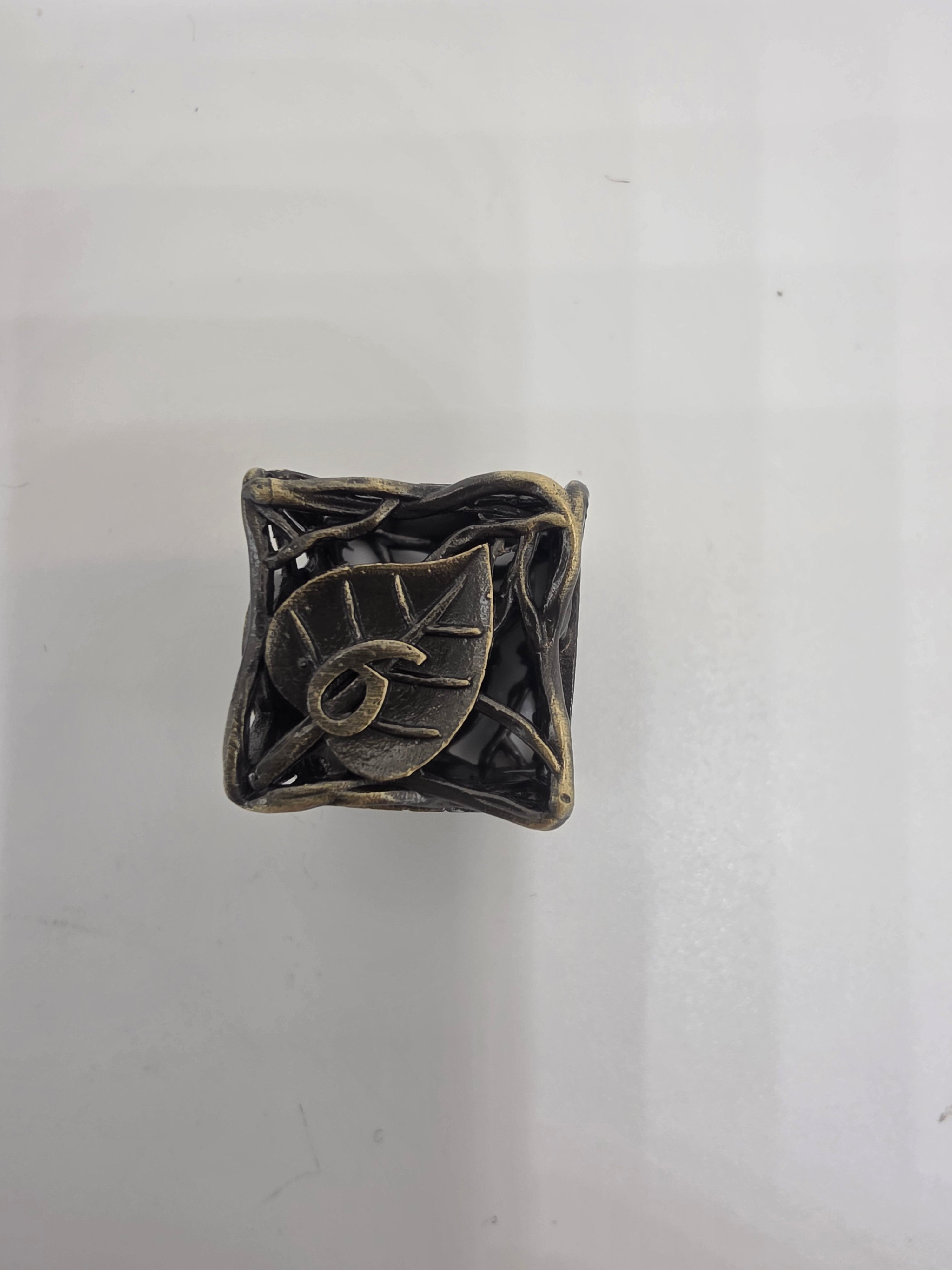 Hollow metal leaf dice set