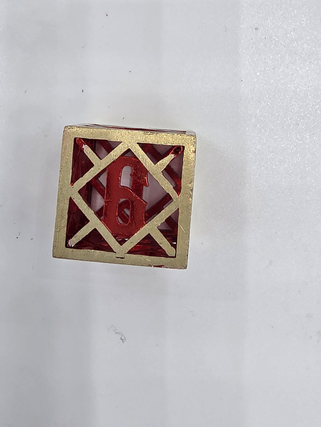 Hollow red and gold dice set